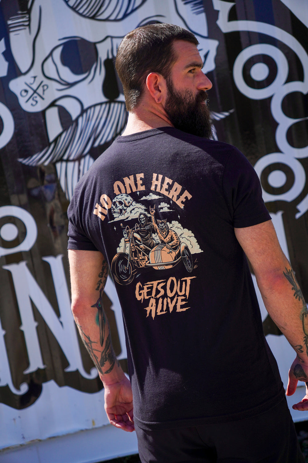 "No One Here Gets Out Alive" Graphic Tee