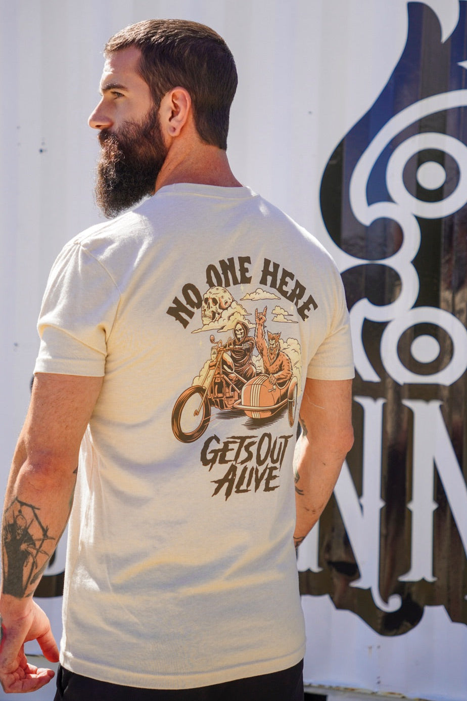 "No One Here Gets Out Alive" Graphic Tee